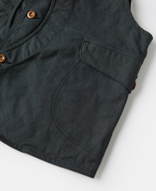 Dark green canvas vest with patch pocket and round brown button at the top