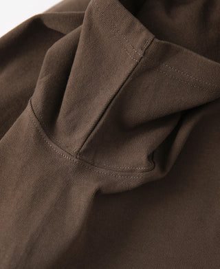 Coffee-brown cotton T-shirt sleeve seam and stitched cuff detail