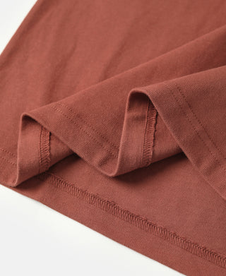 Brick red vintage short sleeve henley T-shirt hem and sleeve cuff close-up
