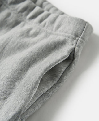 Gray terry cloth sweatpants leg with angled side seam, relaxed fit.