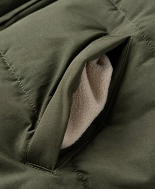 Olive quilted padded vest with open pocket opening and soft inner lining