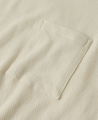 Light apricot waffle-knit chest pocket with visible stitch line