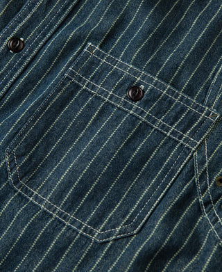Indigo striped chest pocket with flap and dark button