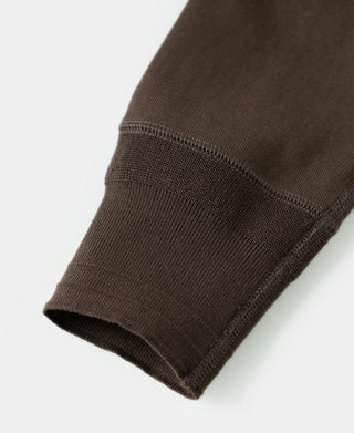 Coffee-brown long-sleeve henley cuff with ribbed knit finish