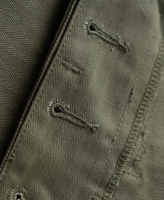 Olive herringbone fabric trousers with close-up front seam and drawcord