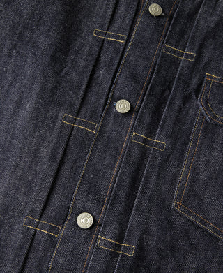 Indigo denim jacket front close-up with vertical seam lines and metal button placket