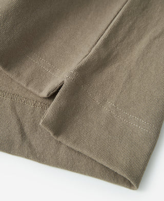 Khaki cotton T-shirt side seam and pocket corner with stitched hem