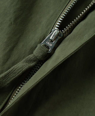 Olive zippered side pocket with metal zipper and snap button tab