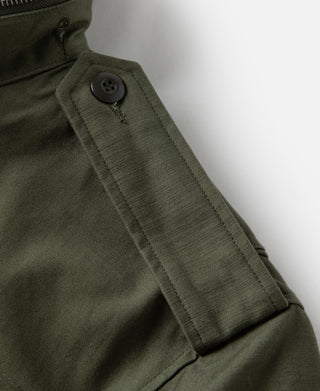 Olive field jacket collar with button placket and top pocket flap