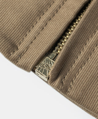 Khaki jacket cuff with zipper and stitched brand label