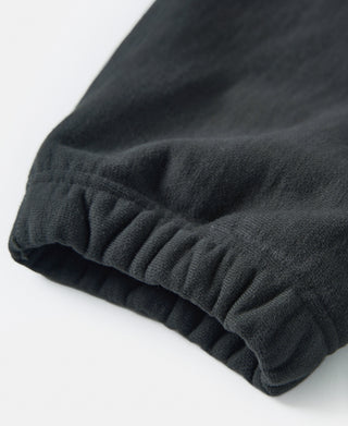 Black terry cloth reverse weave sweatpants, ribbed cuff hem detail