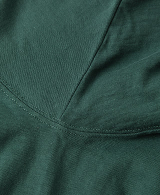 Green pocket seam and curved hem detail on slub cotton T-shirt
