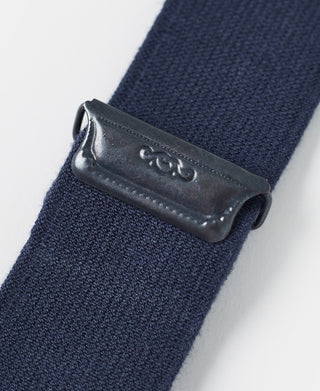 Navy suspender end cap with dark leather tab and metal snap