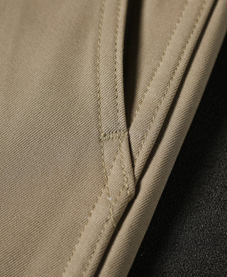 Tan chino trousers with side pleat and reinforced seam at hip