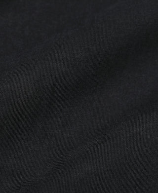 Black cotton T-shirt fabric close-up with fine texture