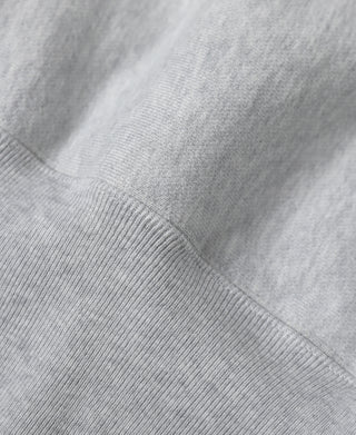 Gray hoodie ribbed hem and knit texture detail, close-up