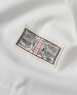 Inside white henley neckline with Bronson Mfg Co care and sizing label
