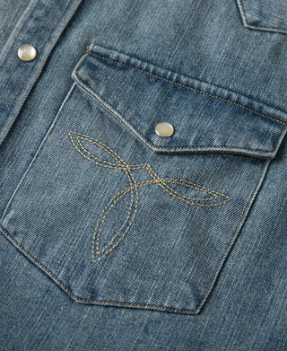 Blue denim western shirt chest pocket with flap and metal snap button