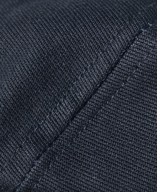 Navy Dixie Cup hat close-up of textured fabric and curved stitching