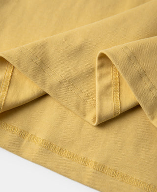 Yellow henley T-shirt hem with double-stitched edge