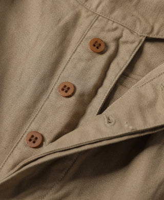 Khaki bermuda shorts with buttoned front and angled seam details