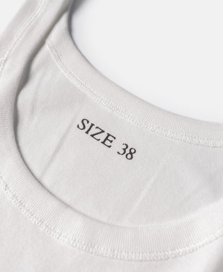 White tank top crew neckline with size label “SIZE 38”