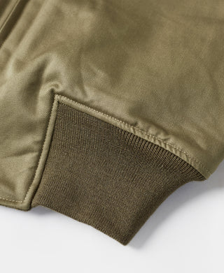 Olive jacket knit sleeve cuff with elastic rib trim at hem edge.