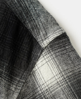 Side view close-up of ombre check sports shirt seam and pocket