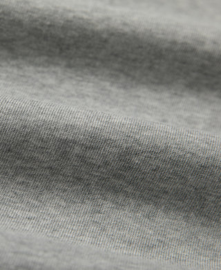 Gray henley T-shirt knit fabric and ribbing detail close-up with visible stitching