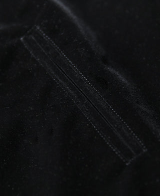 Black reversible jacket panel with visible contrast stitching along the seam.