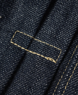 Indigo denim jacket chest pocket with stitched welt and button tab