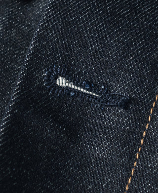 Indigo denim jacket interior pocket edge with contrast selvedge stitching