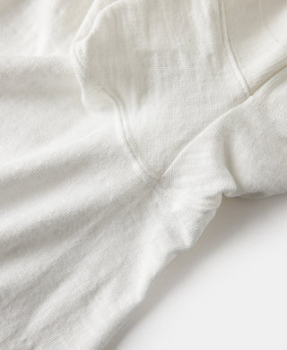 White henley t-shirt fabric texture and side seam detail