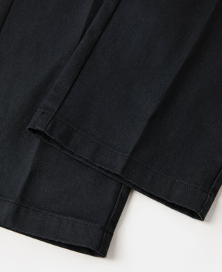Black work pants cuffed hem with visible topstitching