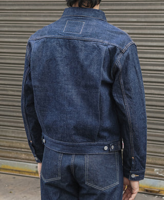 Indigo denim jacket back view with yoke seam and waistband snap tab