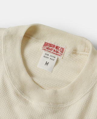 Light apricot waffle-knit T-shirt neckline with size label