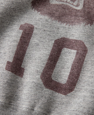Close-up of gray sweater front with maroon number 10 print