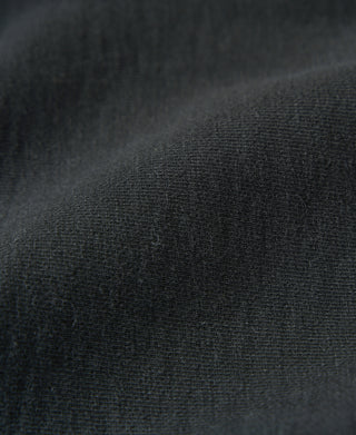 Black terry cloth reverse weave sweatpants, fabric texture close-up