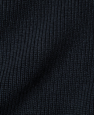 Navy wool sweater knit fabric close-up with fine ribbed pattern