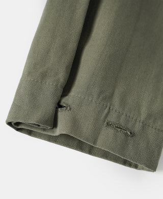 Olive jacket sleeve and hem with stitched cuff and side seam opening