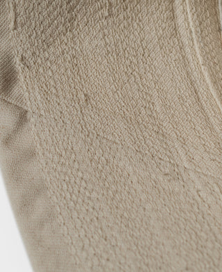 Off-white hat side fabric with vertical seam stitching