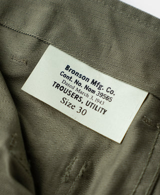 Olive trousers with woven label: Bronson Mfg. Co., size 30