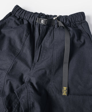 Navy cotton canvas climbing pants with elastic waistband, drawcord, and hanging label
