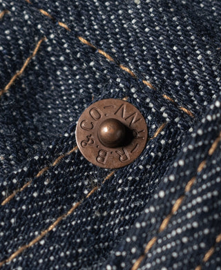 Bronson & Crockett embossed metal button on dark blue denim