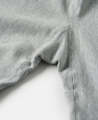 Gray terry cloth sweatpants with ribbed leg opening and stitched hem.