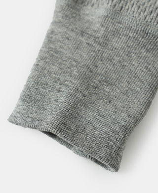 Gray thermal shirt hem and ribbed cuff edge with waffle knit texture, close-up