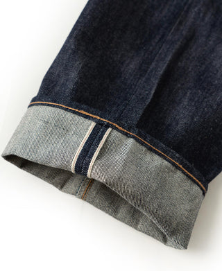 Denim hem with selvedge edge and contrast orange stitch line