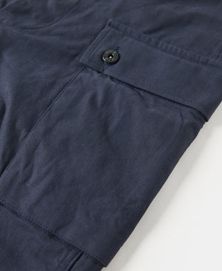 Navy utility shorts with rear pocket flap and metal button detail