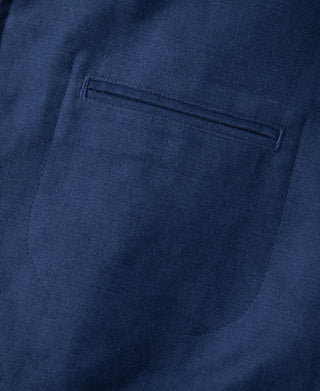 Blue jacket chest pocket with stitched flap opening