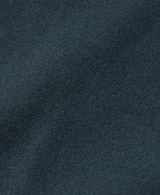 Dark vintage cotton T-shirt fabric texture close-up